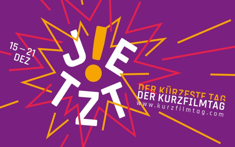 Bunte Grafik mit dem Wort 'JETZT' in weiß und gelb, umgeben von gelben und roten Linien, dazu Text '15-21 DEZ' und 'DER KÜRZESTE TAG DER KURZFILMTAG