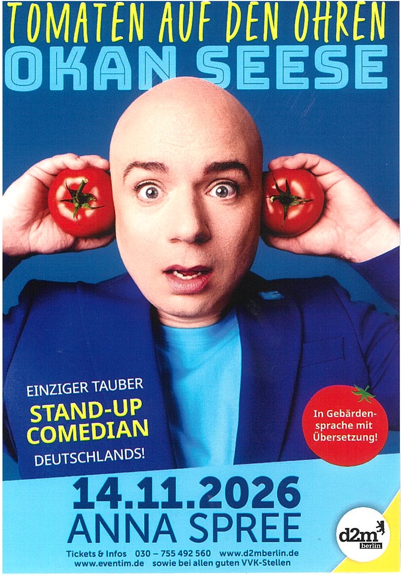 Porträt eines Mannes mit Glatze, der zwei Tomaten an seine Ohren hält, vor blauem Hintergrund mit Texten zu einem Stand-up-Comedy-Auftritt von Okan Seese am 14.11.2026.
